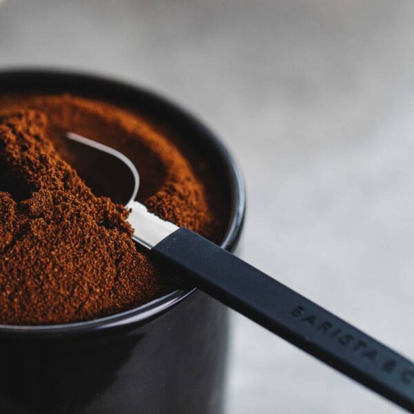 Coffee scoop in ground coffee